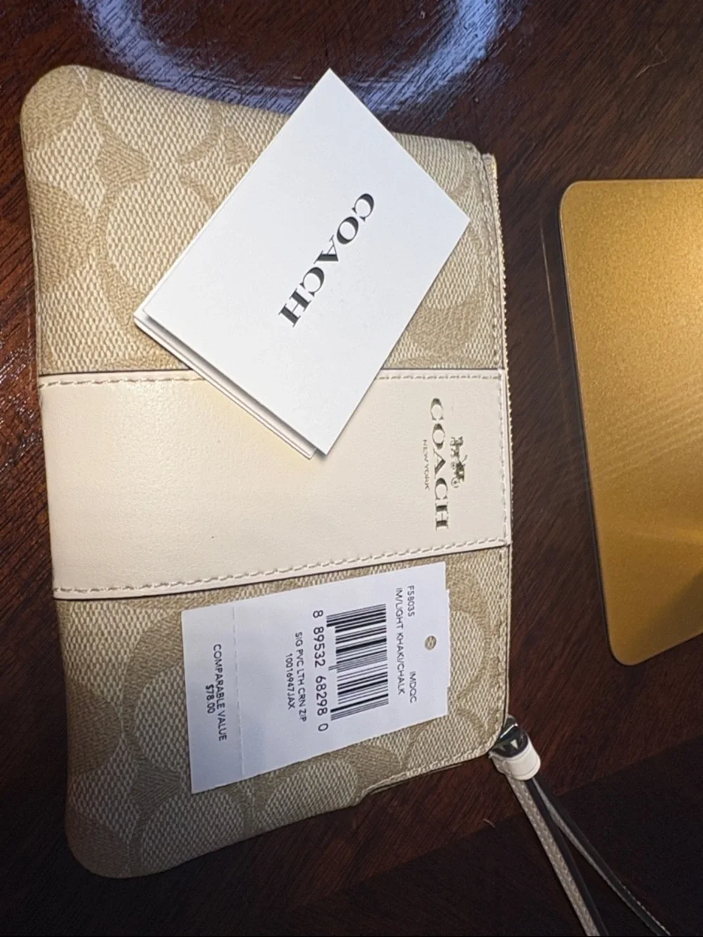 Coach Beige & White Signature Wristlet with Gold Logo